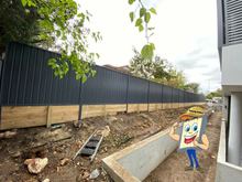 Colorbond Fence with Treated Pine Timber Sleeper Retaining Wall Directly under New Colorbond Fence