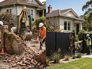 Brick wall coming down, then a new Colorbond fence on the same line