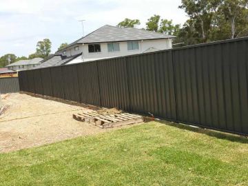 Installed Colorbond sheets forming a privacy boundary.