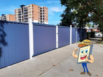 Installed Colorbond sheets forming a privacy boundary with a matching gate opening.