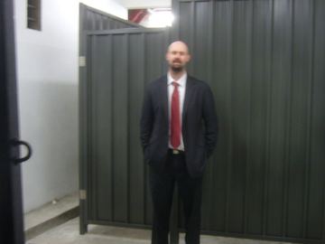 Customer in front of a new grey Colorbond gate