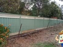 Pale green Colorbond fence with a lattice topper