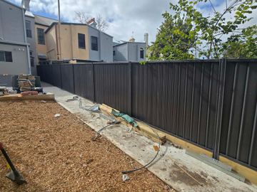 New treated pine palings on a residential block.