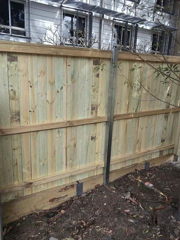 New treated pine palings on a residential block.