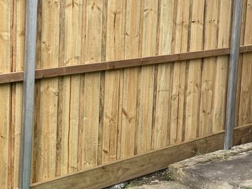 New treated pine palings on a residential block.