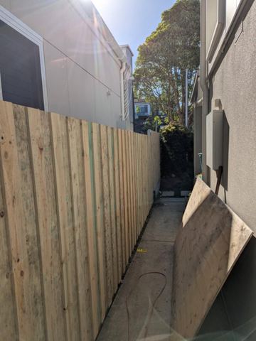 New treated pine palings on a residential block.