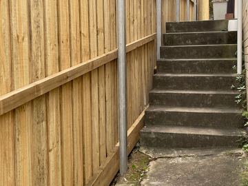 New treated pine palings on a residential block.