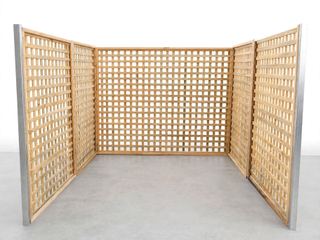 Three framed square timber lattice panels forming a corner bay on silver posts