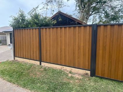 Light Oak woodgrain steel sheets above a lawn